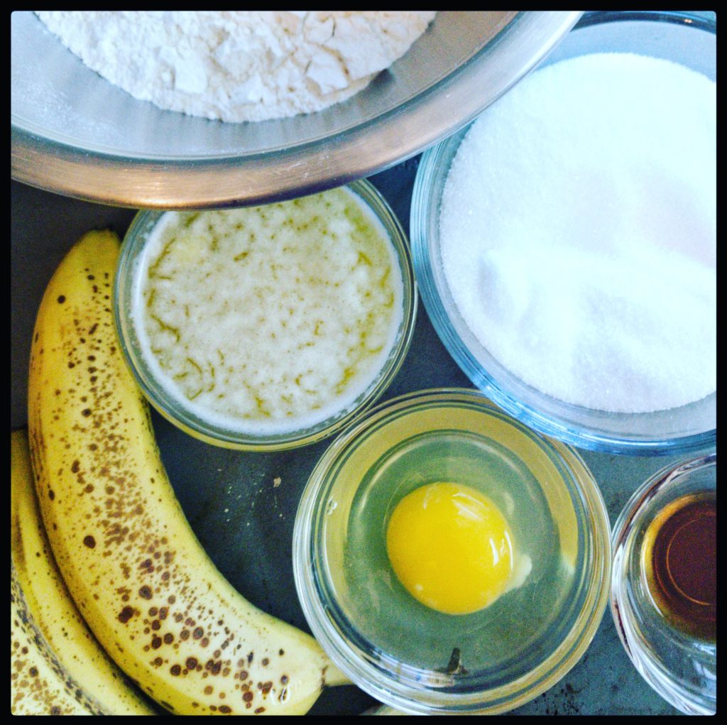 Bowls containing ingredients for banana bread. 