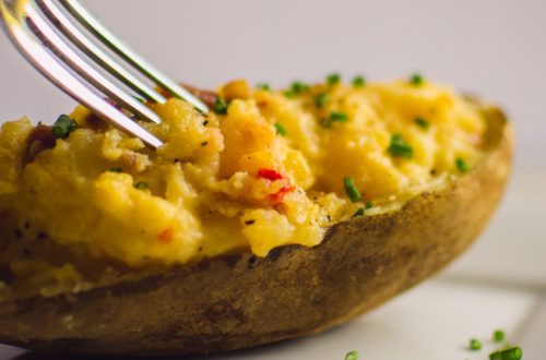 Fork in cheesy potato