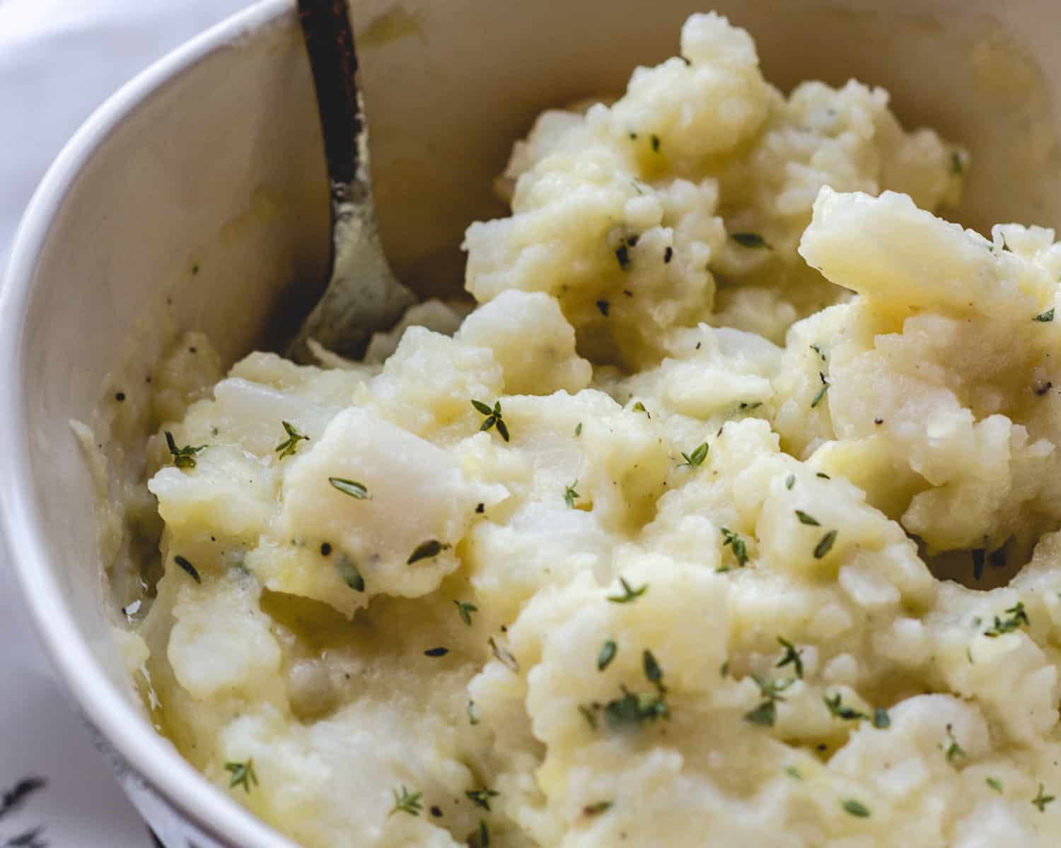 Bowl of buttery mashed turnips and potatoes