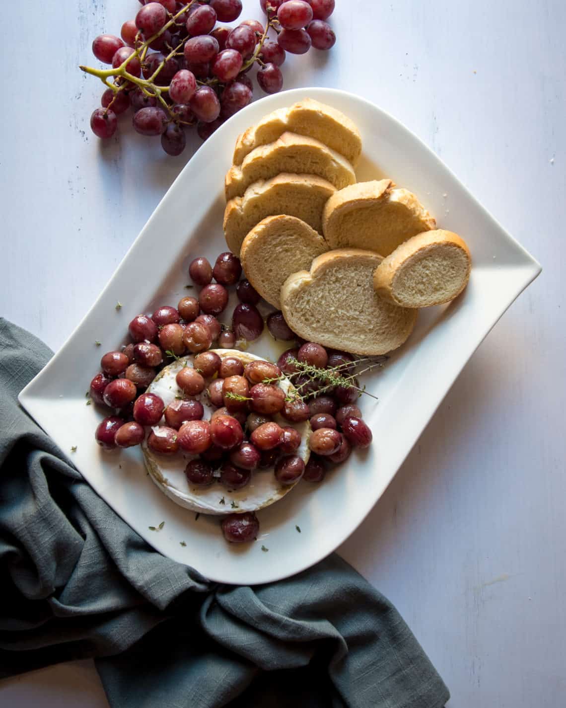Plate of roasted grapes and baked brie