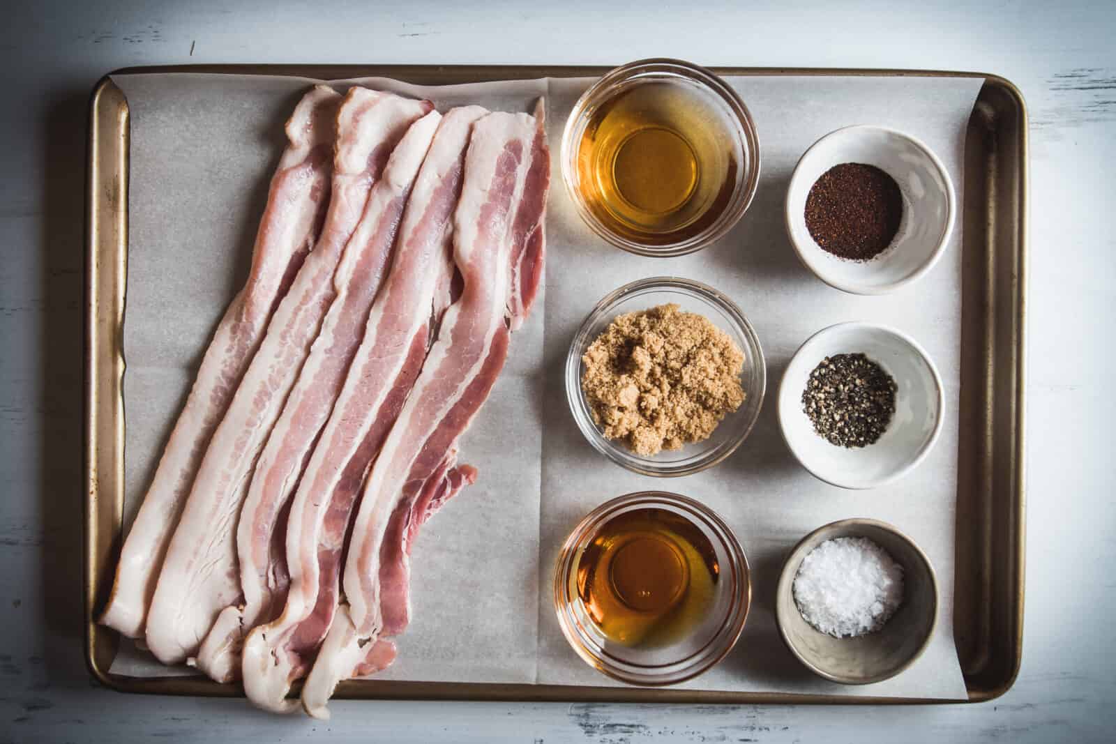 Candied bacon recipe ingredients on a pan. 