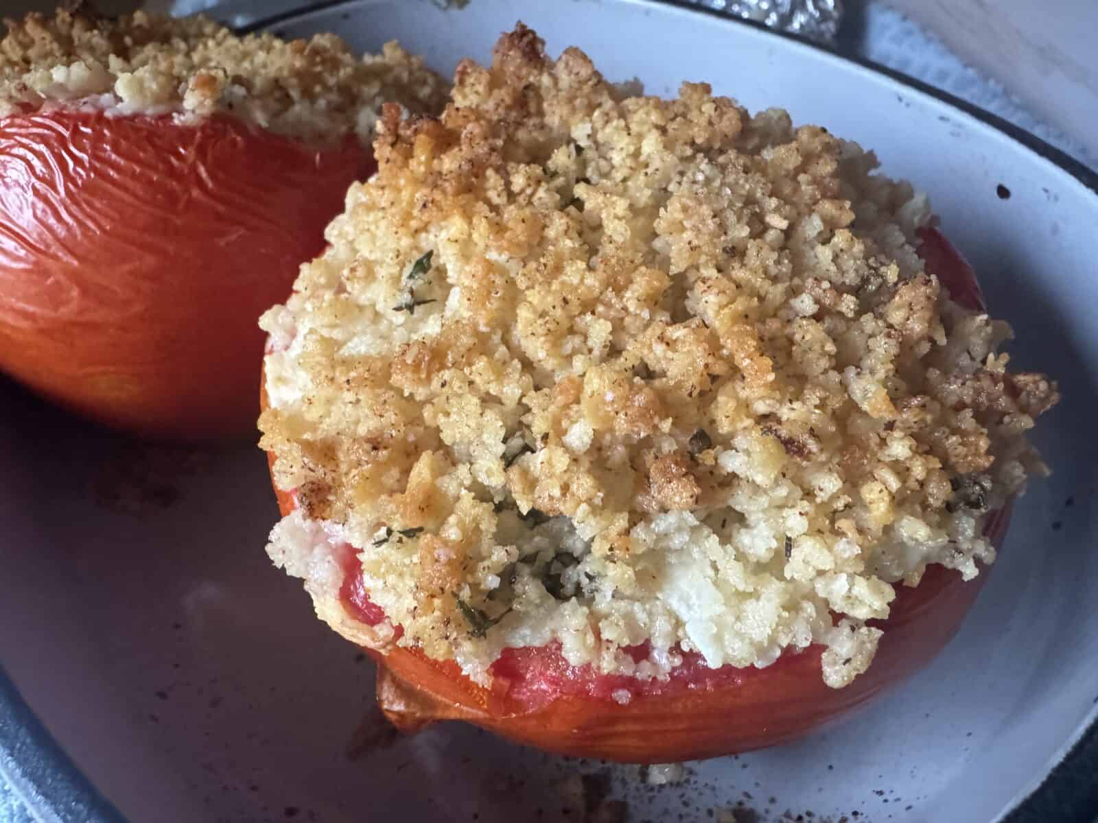 Baking dish with two stuffed tomatoes. 