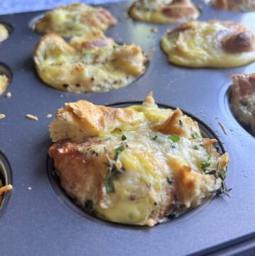 Savory croissant egg bites cooling in muffin tray