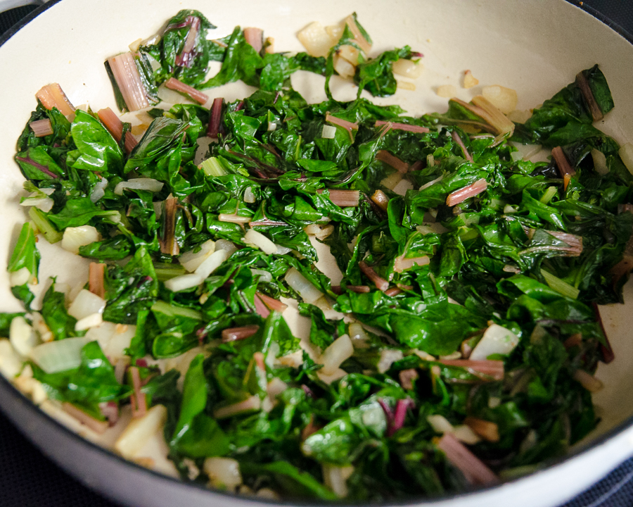 Swiss chard, onions and garlic in a skillet. 